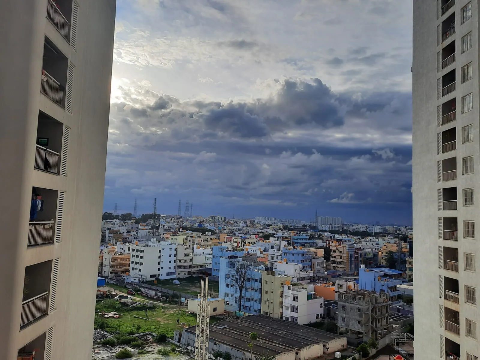 View across central Bengaluru rooftops from an apartment balcony