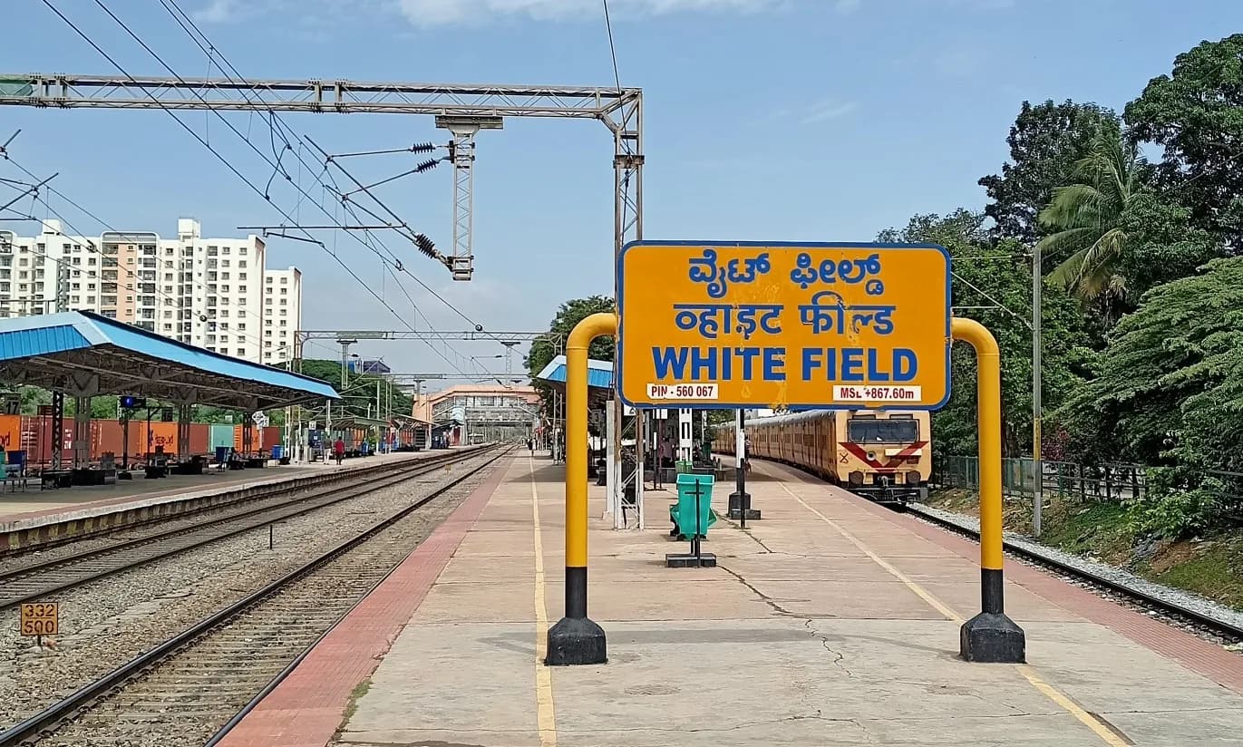 Whitefield railway station platform and nameboard in Kannada, Hindi and English